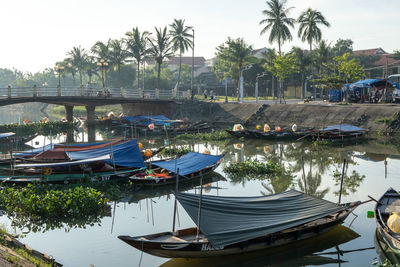 Boats moored at harbor
