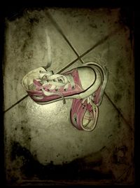 High angle view of shoes on abandoned floor