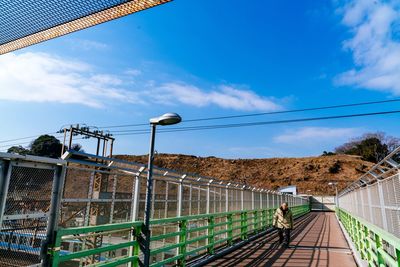 Footbridge against sky