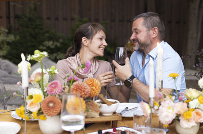 Friends toasting wineglasses at home