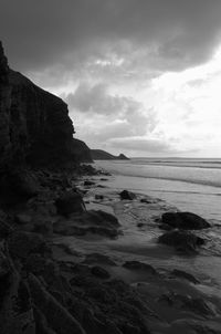 Scenic view of sea against cloudy sky