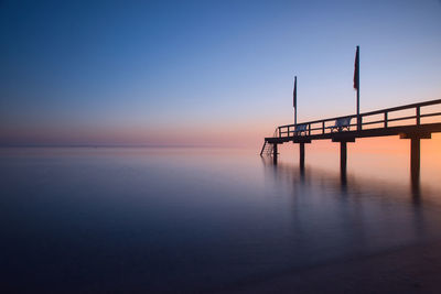 Scenic view of sea against clear sky during sunset