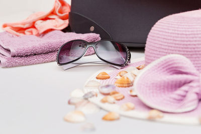 Close-up of sunglasses with hat