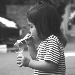 Close-up of girl holding camera