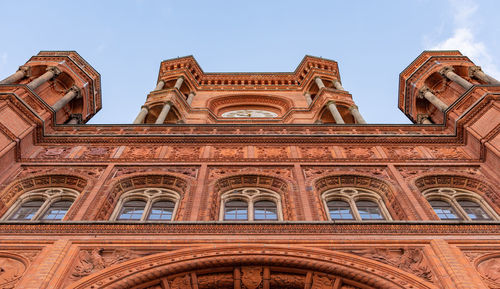 Low angle view of historical building against blue sky