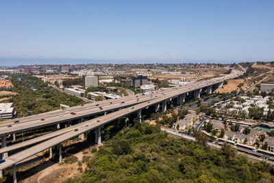 High angle view of elevated road and cityscape against sky