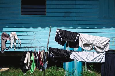 Clothes drying on clothesline against building