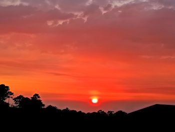 Scenic view of silhouette landscape against romantic sky at sunset