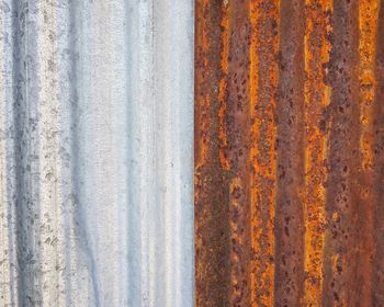 Close up of new and old corrugated iron sheet