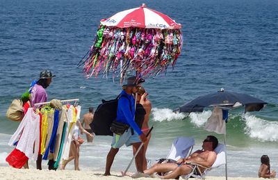 People on beach by sea