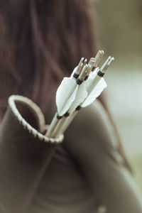 Close-up of hand holding cigarette