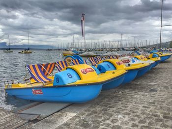 Boats moored at harbor