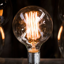 Close-up of illuminated light bulb