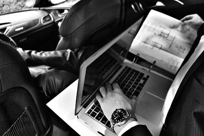 High angle view of man using laptop