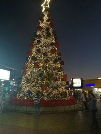 Illuminated christmas tree at night