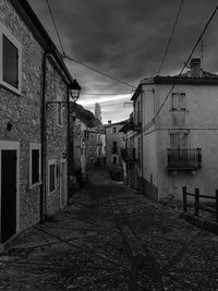 Houses in town against sky