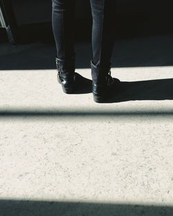 Low section of woman standing on floor