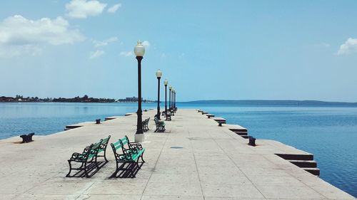 Scenic view of pier on sea against sky