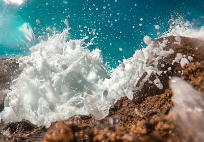 Waves splashing on rocks at shore