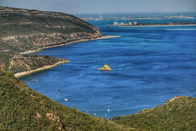 High angle view of sailboat on sea shore against sky