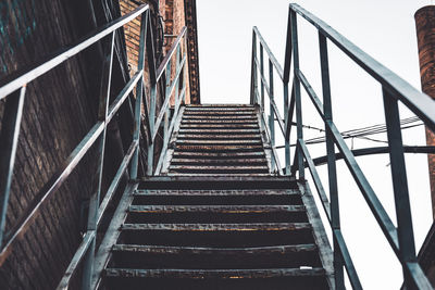 Low angle view of staircase in building against sky