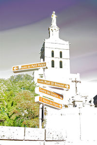 Information sign in city at night
