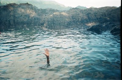 Man swimming in sea