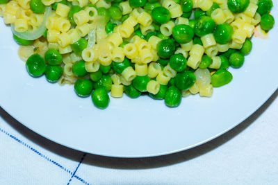 High angle view of chopped vegetables in plate on table