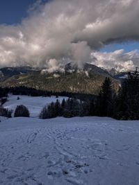 Scenic view of snowcapped mountains against sky