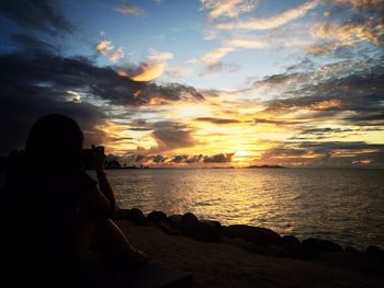 Scenic view of sea at sunset