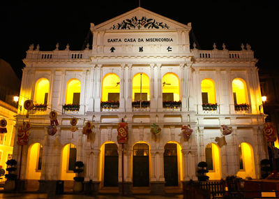 Low angle view of historical building at night