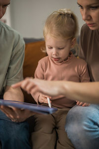 Portrait of siblings sitting at home