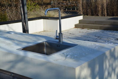 Faucet on retaining wall outdoors