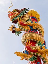 Golden chinese dragon sculpture on the pole