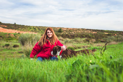 Woman sitting on field