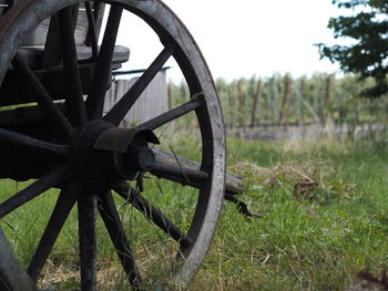 Close-up of abandoned wheel on field