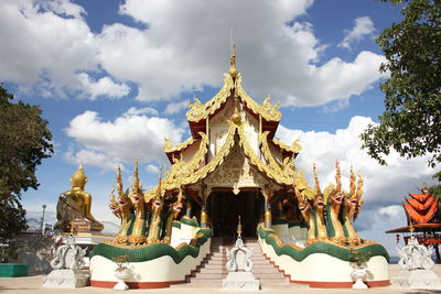 Panoramic view of temple against building