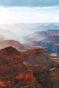 Scenic view of canyon against cloudy sky