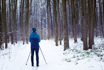 Man standing on snow covered land