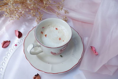 High angle view of coffee cup on table