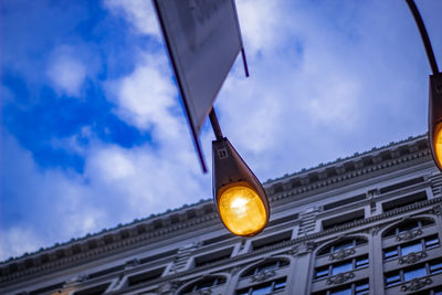 Low angle view of illuminated building against sky