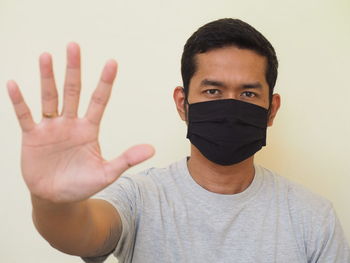 Portrait of man against white background