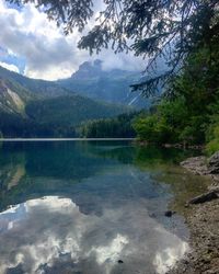 Scenic view of lake and mountains against sky