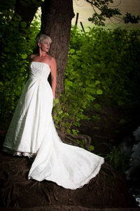 Woman standing on tree