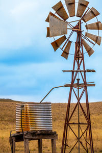 Traditional windmill against sky