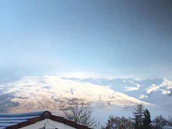 Scenic view of snow mountains against sky