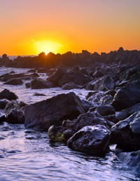 Scenic view of sea against sky during sunset