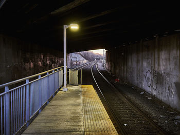 Illuminated street light at railroad station