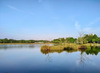 Scenic view of lake against blue sky