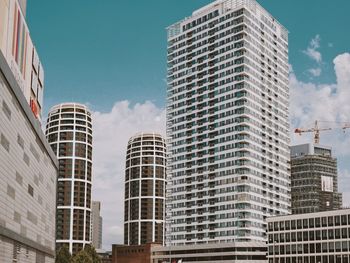 Low angle view of buildings in city against sky